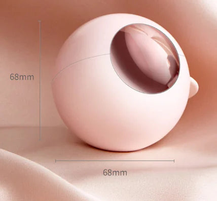 Pink spherical object with measurement details on a beige background